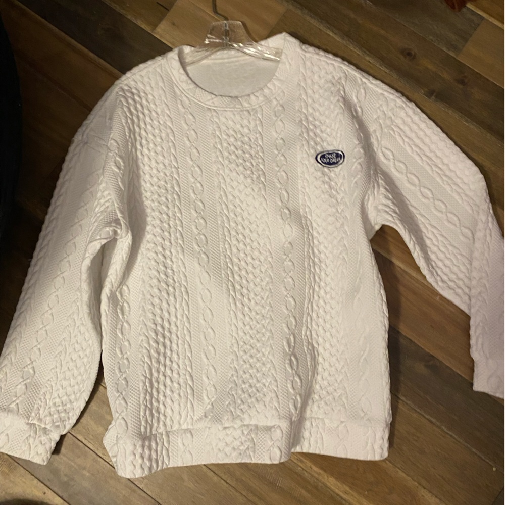 White lightweight sweater that says “chase your dreams”